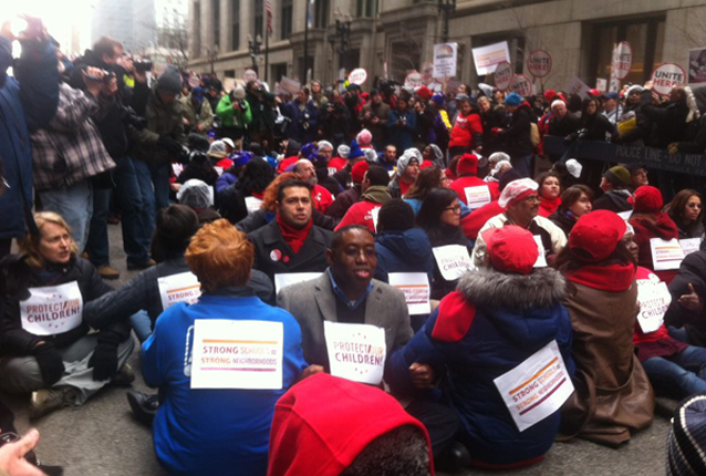 Front row facing forward: Elce Redmond, Chicago Jobs with Justice Co-Chair and Jobs with Justice National Board member, risking arrest in support of Chicago teachers strike
